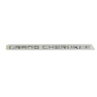 Emblemat z boku drzwi *Grand Cherokee*